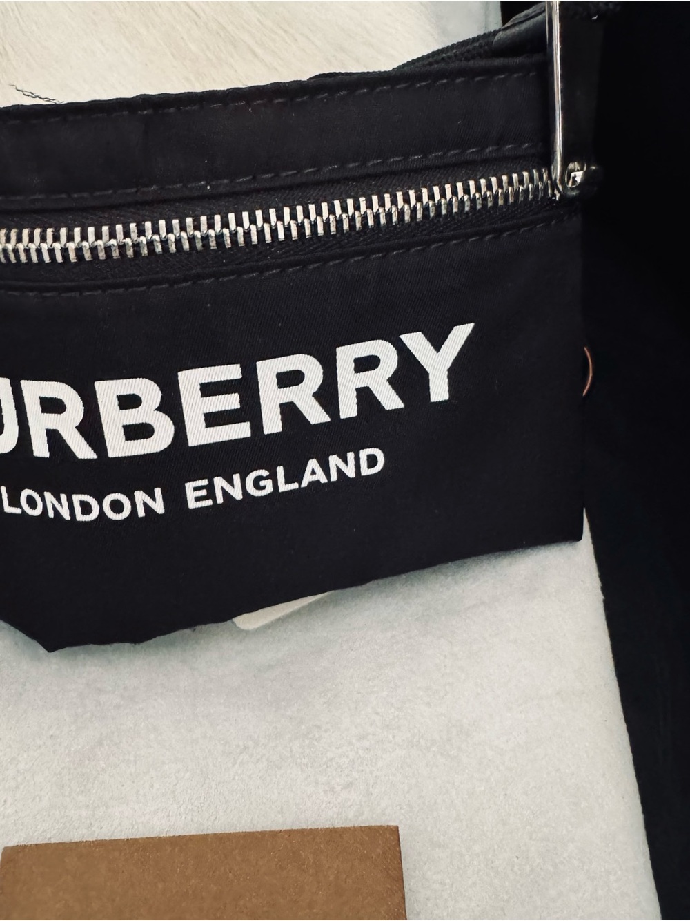 Burberry , Arm wallet with Black elastic back .